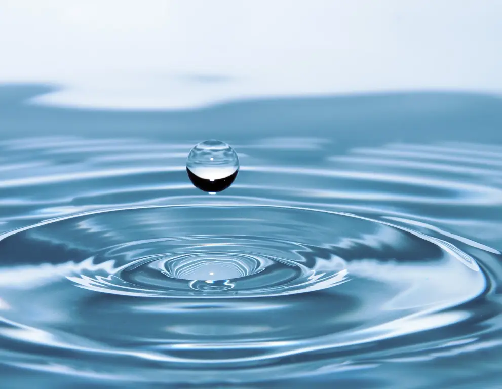 A water drop falling into the ocean.