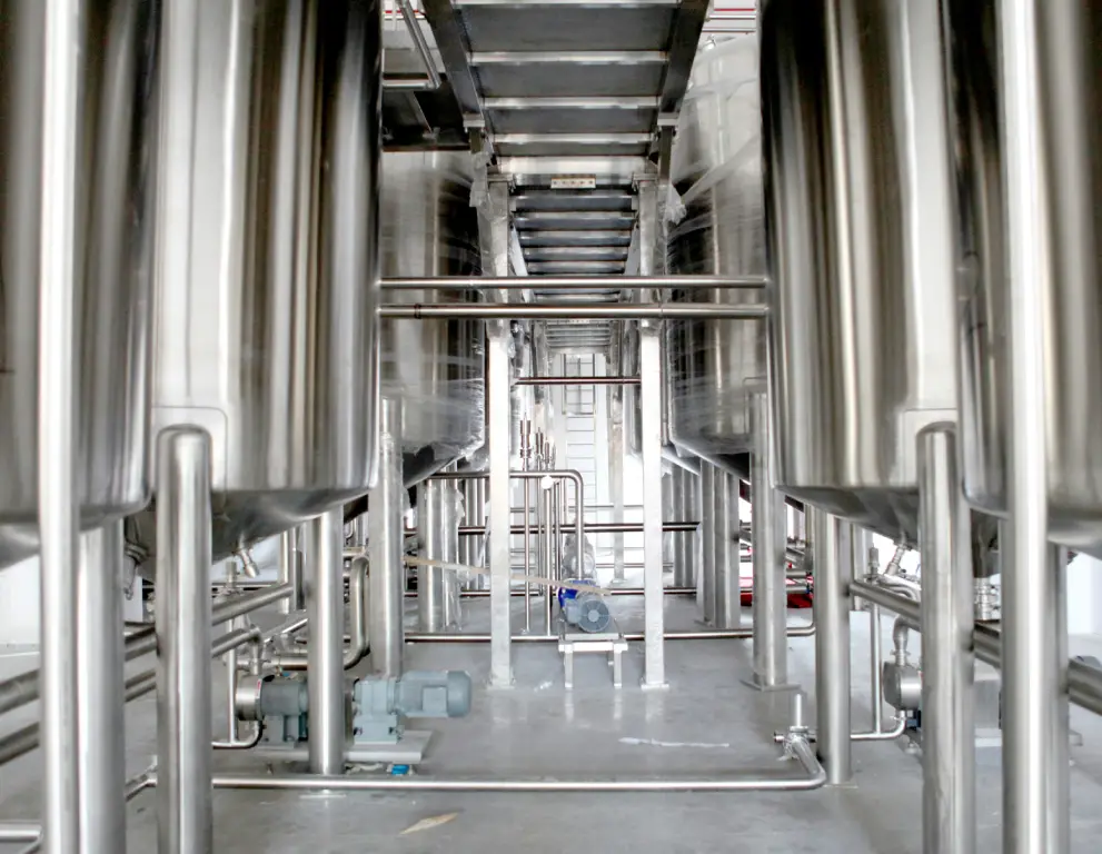 A large metal tank in a factory.