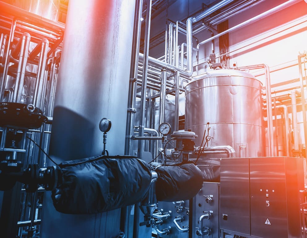 Industrial machinery with pipes and tanks.