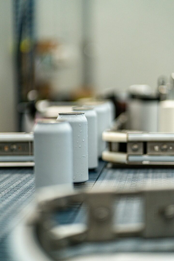Cans on a conveyor belt in a factory.