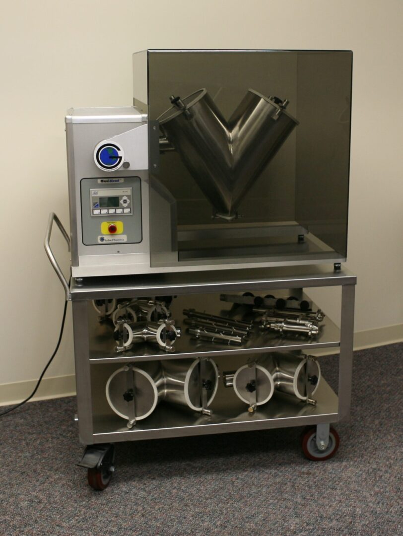 V-shaped mixing machine on a metal cart.