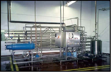 Industrial processing equipment in a factory setting.