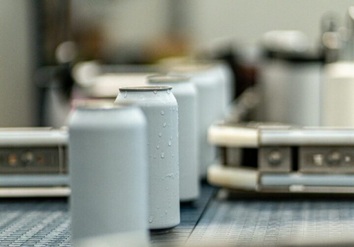 Cans on a conveyor belt in a factory.